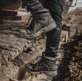 Amblers FS32 safety boots gripping muddy excavator tracks showing tread and ankle support