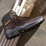 Caterpillar Striver S3 brown safety boot showing slip-resistant sole tread on construction site