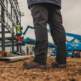 Caterpillar Striver XL S7 brown dealer boots worn on construction site with steel framework
